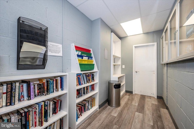 hallway with hardwood / wood-style floors