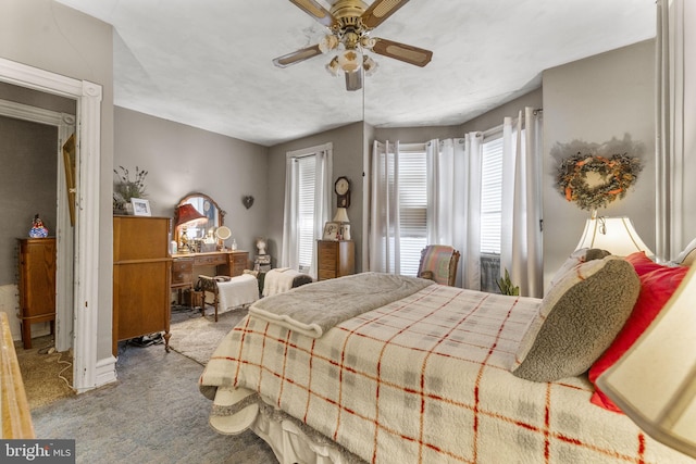 bedroom with light carpet and ceiling fan