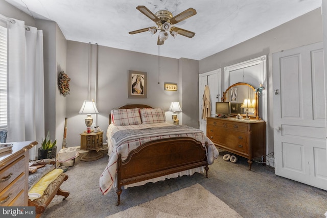 carpeted bedroom featuring ceiling fan