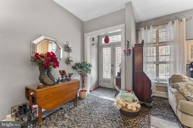 foyer with french doors and plenty of natural light