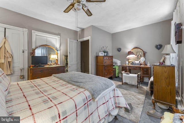 carpeted bedroom featuring ceiling fan