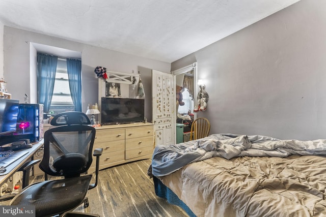 bedroom featuring hardwood / wood-style flooring