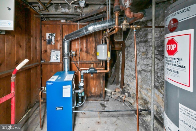 utility room featuring water heater