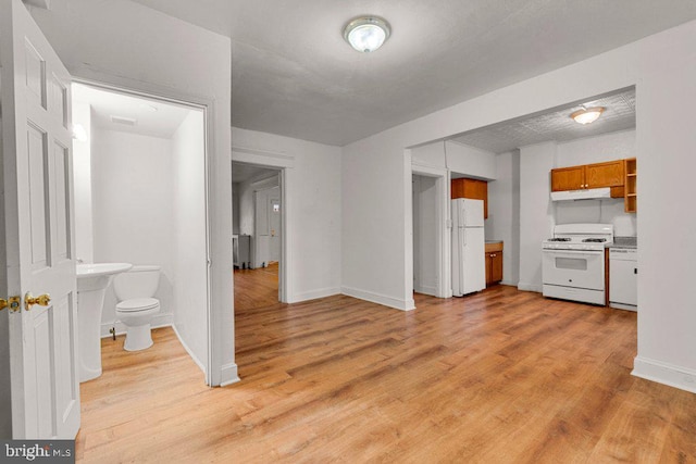 unfurnished living room featuring light wood-type flooring