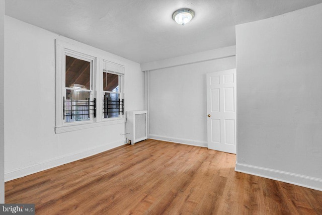 spare room featuring hardwood / wood-style flooring