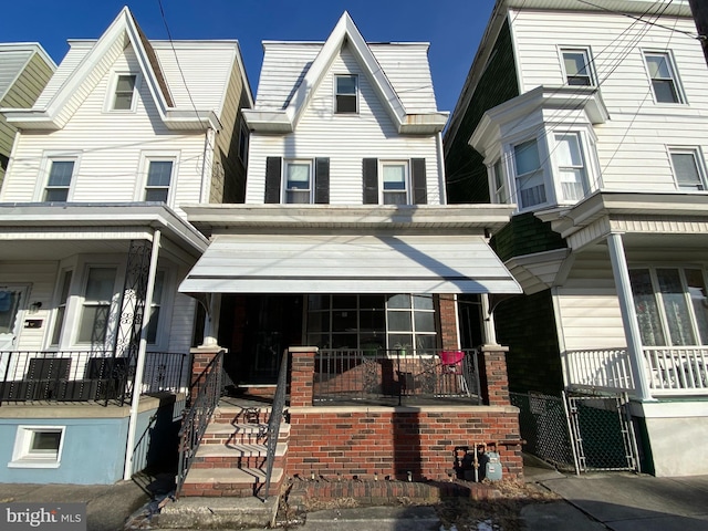 multi unit property featuring a porch