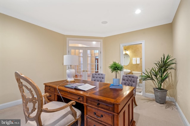 home office featuring french doors, crown molding, and light carpet