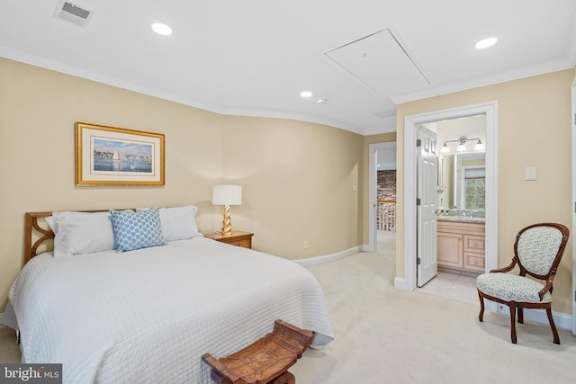 bedroom with crown molding, light colored carpet, and connected bathroom