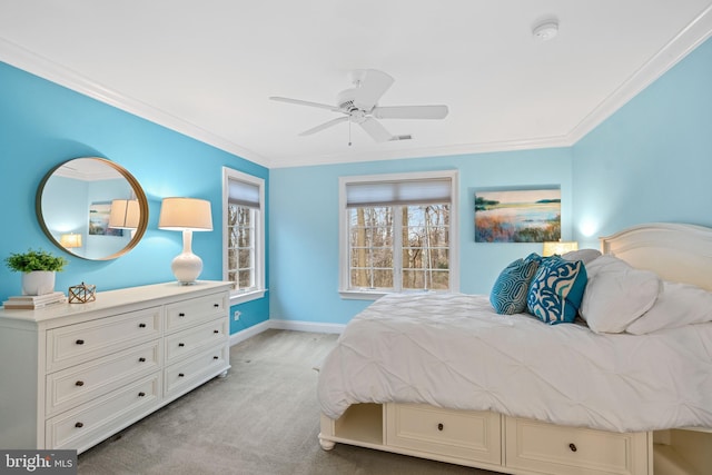 carpeted bedroom featuring crown molding and ceiling fan