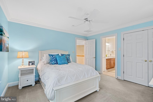 bedroom with light carpet, crown molding, ceiling fan, and ensuite bathroom