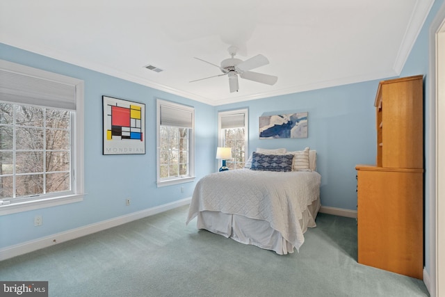 bedroom with crown molding, light carpet, and ceiling fan