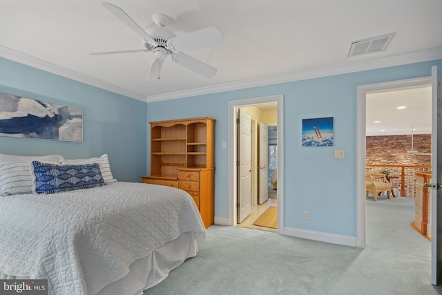 carpeted bedroom featuring ceiling fan and ornamental molding