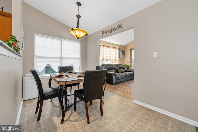 dining area with lofted ceiling