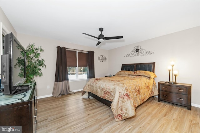 bedroom featuring light hardwood / wood-style flooring and ceiling fan