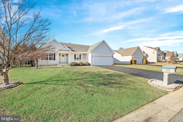 ranch-style home featuring a garage and a front lawn