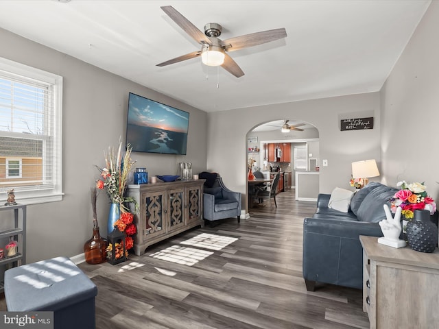 living room featuring dark hardwood / wood-style floors and ceiling fan