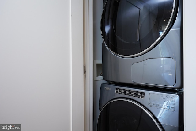 washroom with stacked washer / drying machine