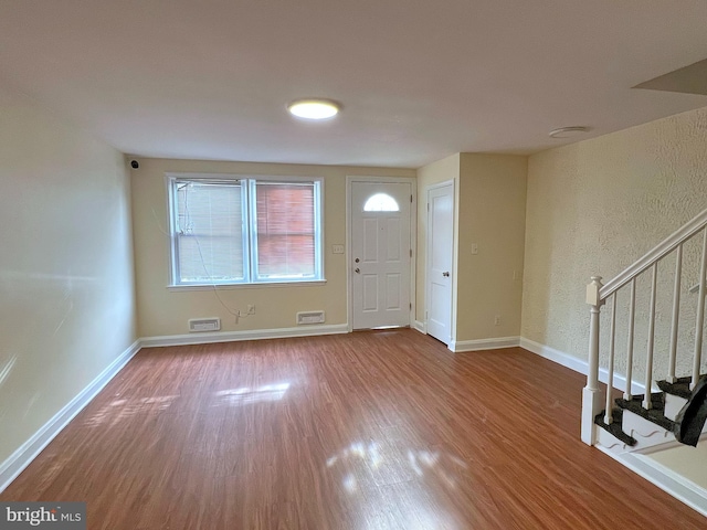 foyer entrance featuring hardwood / wood-style floors