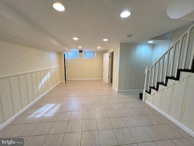 basement with light tile patterned flooring