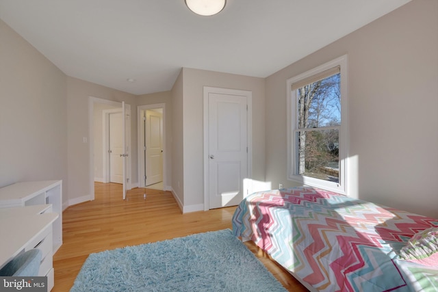 bedroom with light hardwood / wood-style floors