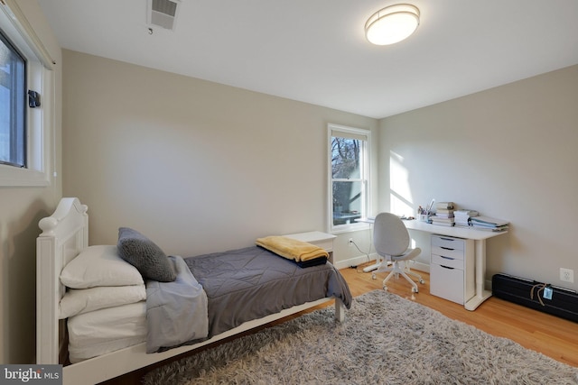 bedroom featuring wood-type flooring