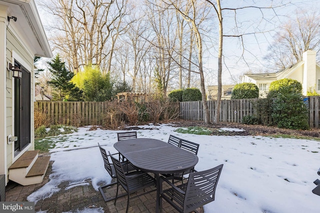 view of snow covered patio