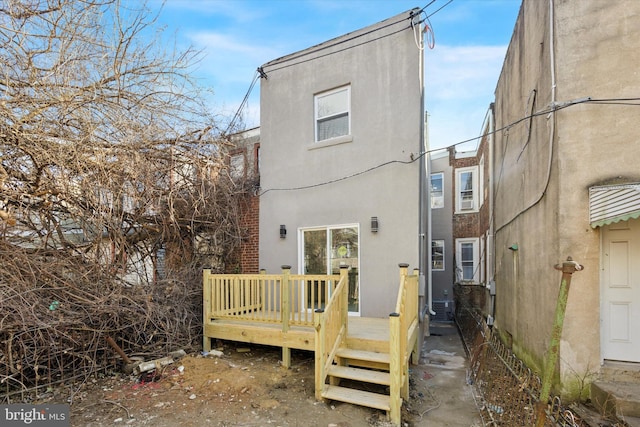 rear view of house with a deck