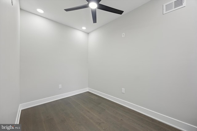 unfurnished room featuring dark wood-type flooring and ceiling fan