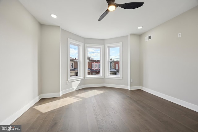 unfurnished room featuring hardwood / wood-style floors and ceiling fan