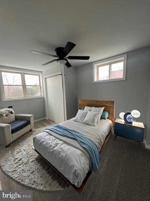 bedroom with carpet floors, a closet, and ceiling fan