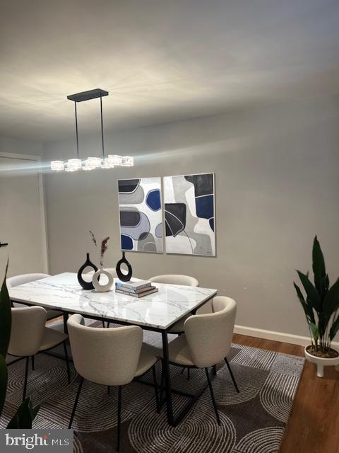 dining space featuring hardwood / wood-style flooring