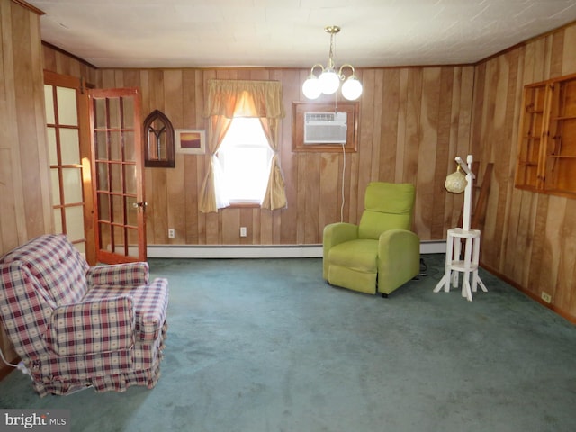 living area featuring an inviting chandelier, a wall mounted air conditioner, carpet, and a baseboard heating unit