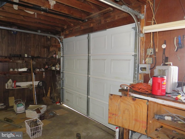 garage featuring wooden walls