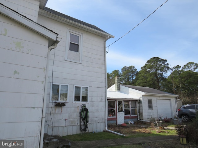 view of side of property with a garage