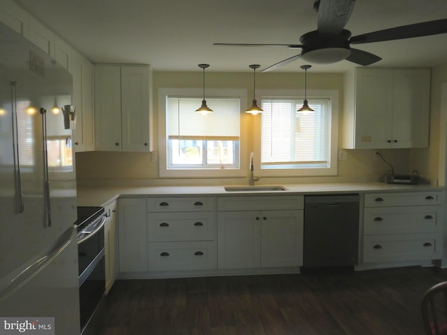 kitchen with high end fridge, sink, white cabinetry, electric range oven, and dishwasher