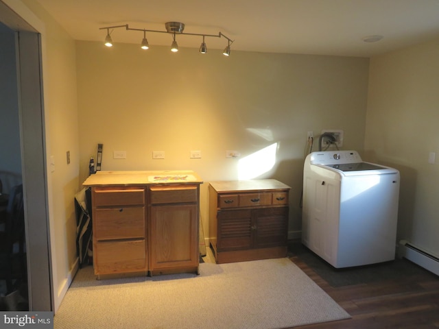 laundry room featuring washer / clothes dryer, hardwood / wood-style flooring, cabinets, and baseboard heating