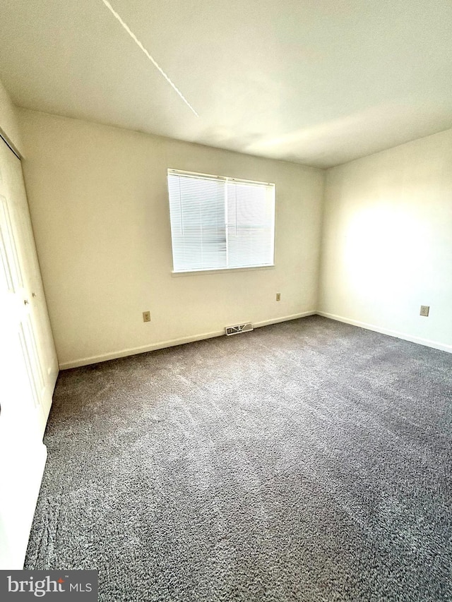 unfurnished room with carpet