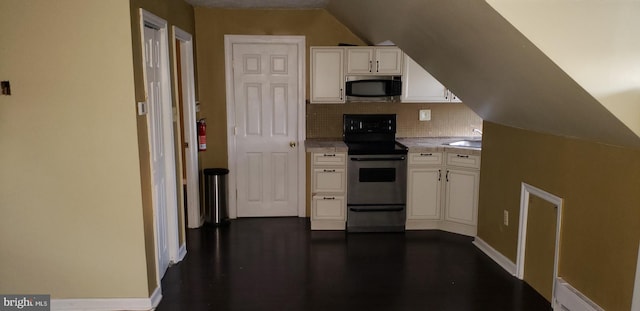 kitchen featuring electric range oven, dark wood-type flooring, sink, and white cabinets