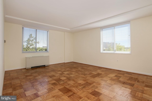 unfurnished room with parquet floors