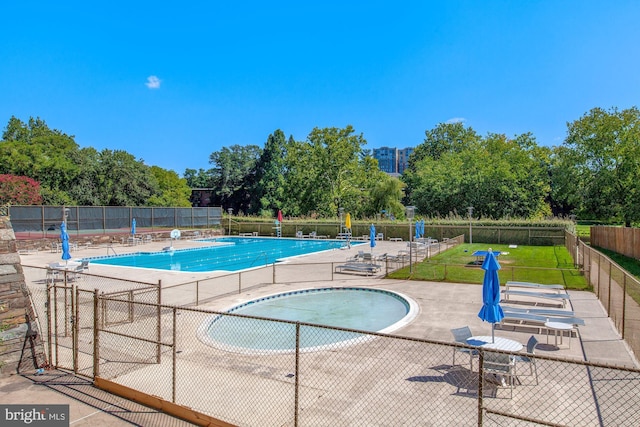 view of swimming pool featuring a patio