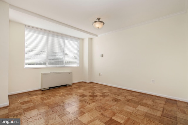 spare room with crown molding and light parquet flooring