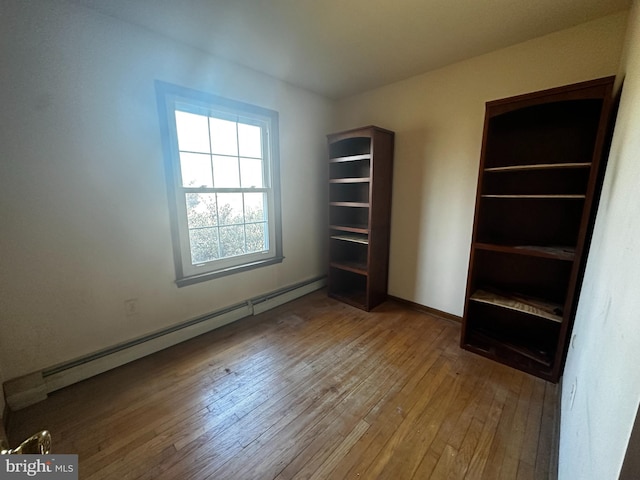 interior space featuring a baseboard radiator and wood-type flooring