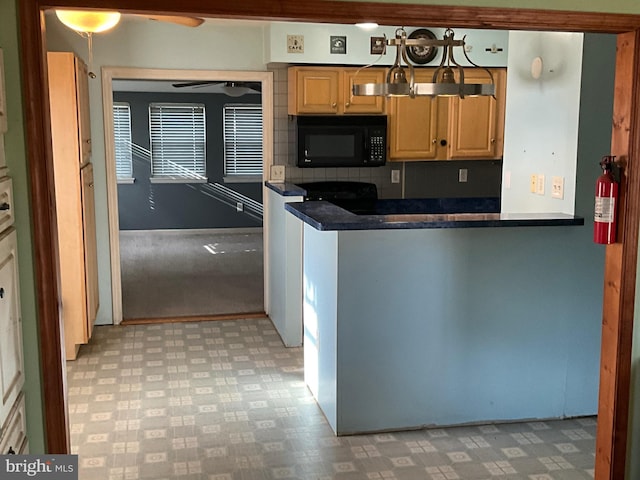 kitchen featuring ceiling fan and backsplash