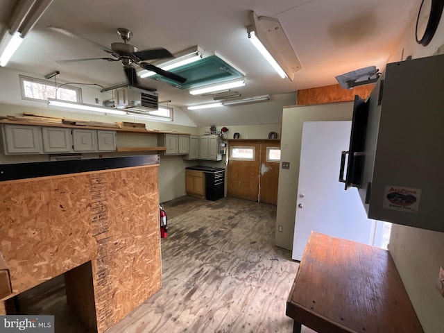 kitchen featuring light hardwood / wood-style flooring, cream cabinetry, and ceiling fan