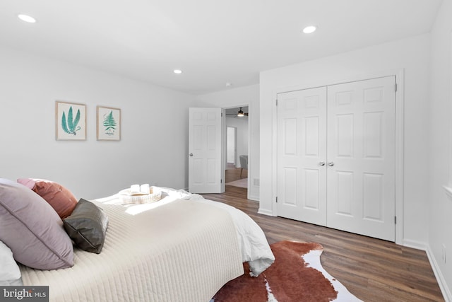 bedroom featuring dark hardwood / wood-style floors and a closet