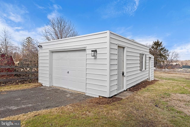 garage featuring a yard