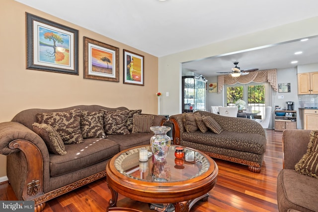 living room with hardwood / wood-style flooring and ceiling fan