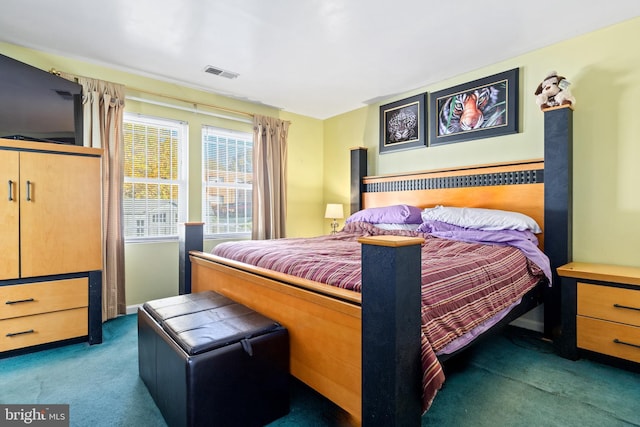 bedroom featuring dark colored carpet