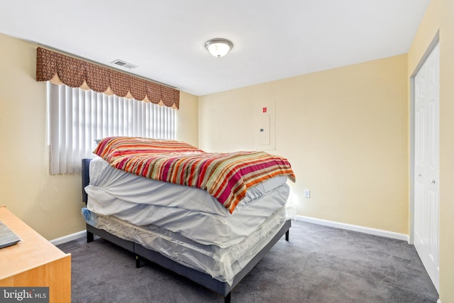 bedroom with dark carpet