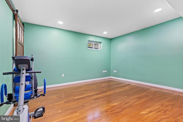 exercise room featuring hardwood / wood-style flooring